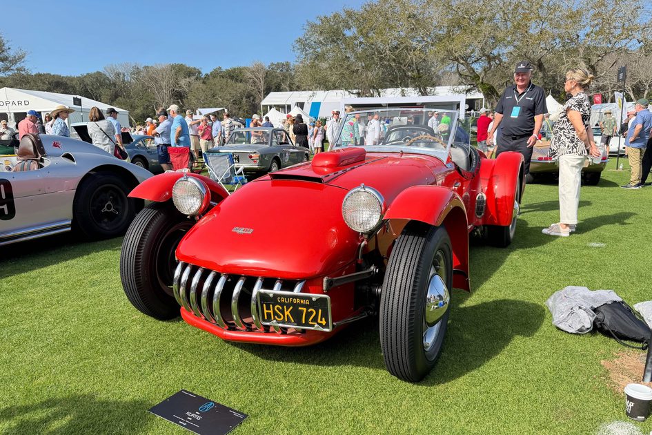 a red 1954 kurtis 500s displayed at the 2026 amelia concours